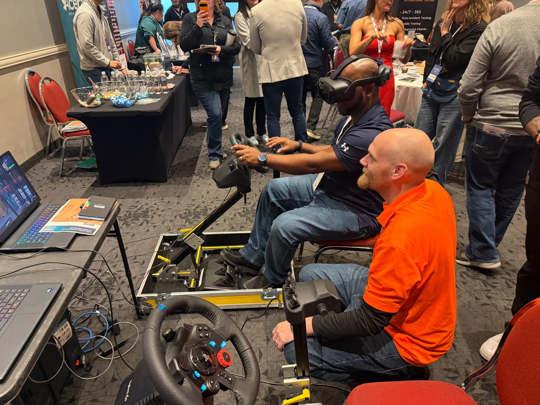 Attendees explore the simulator stations.