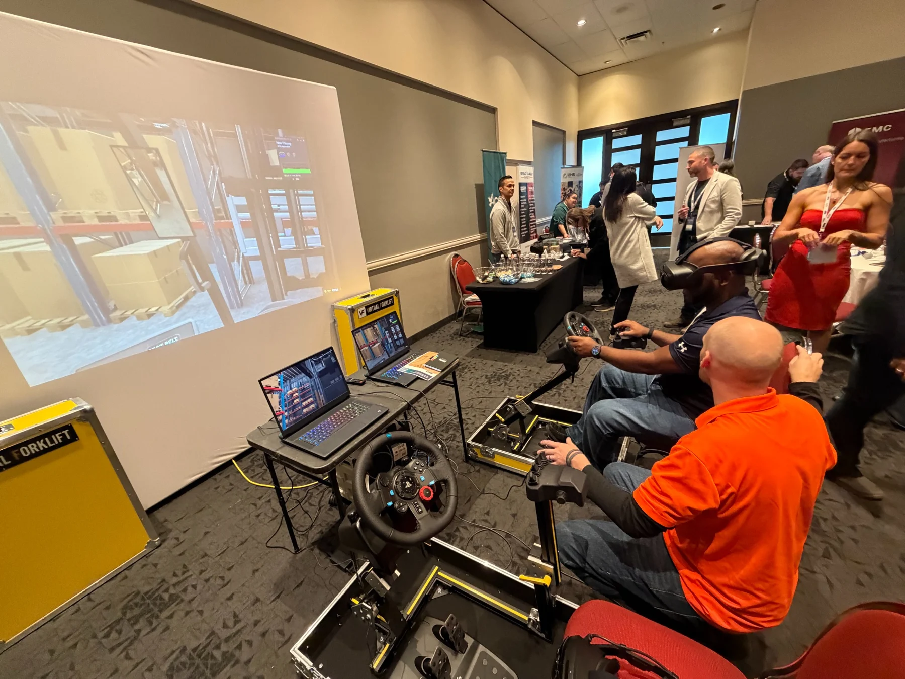 The simulator view is projected for people watching.